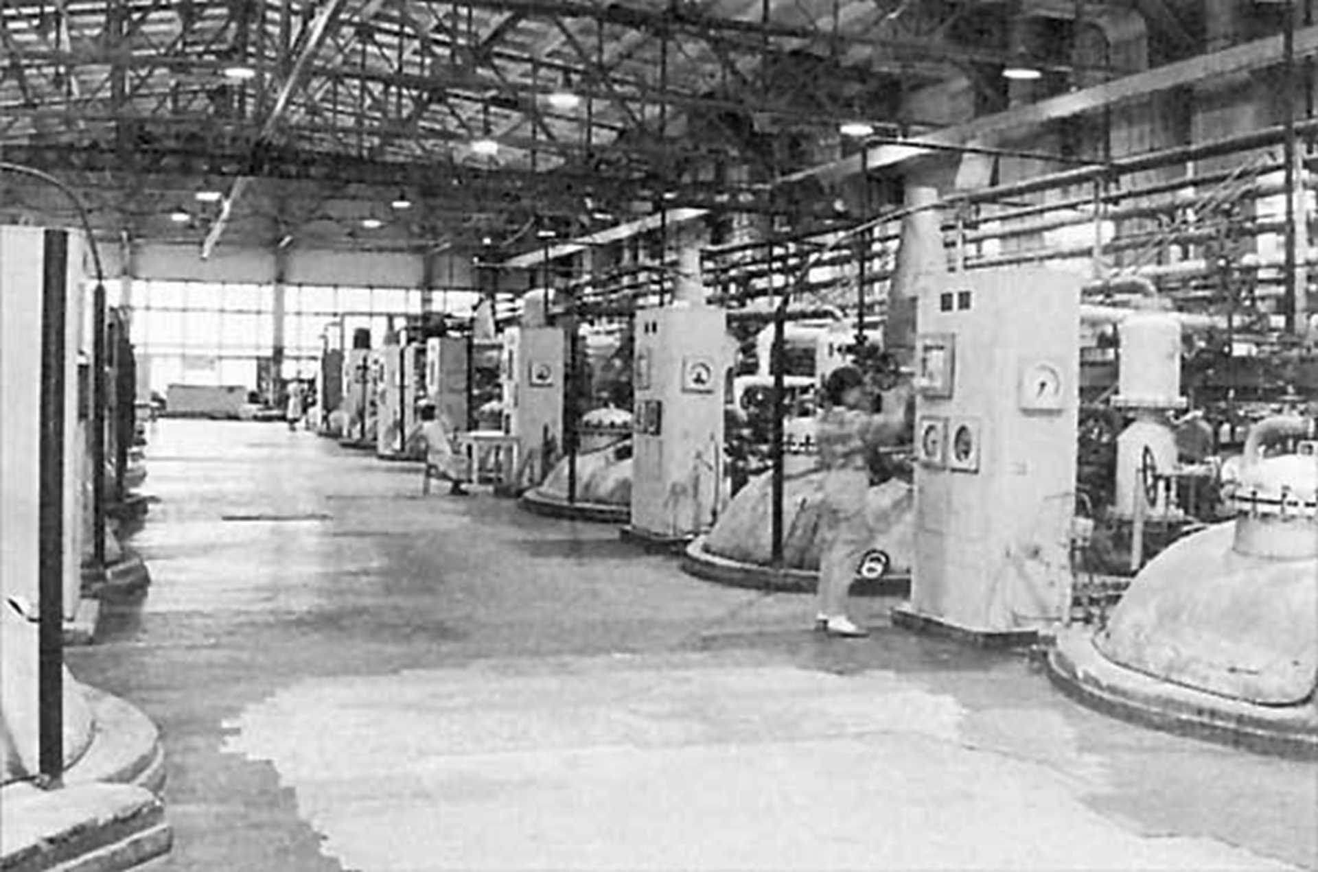Black and white photography of a factory interior.