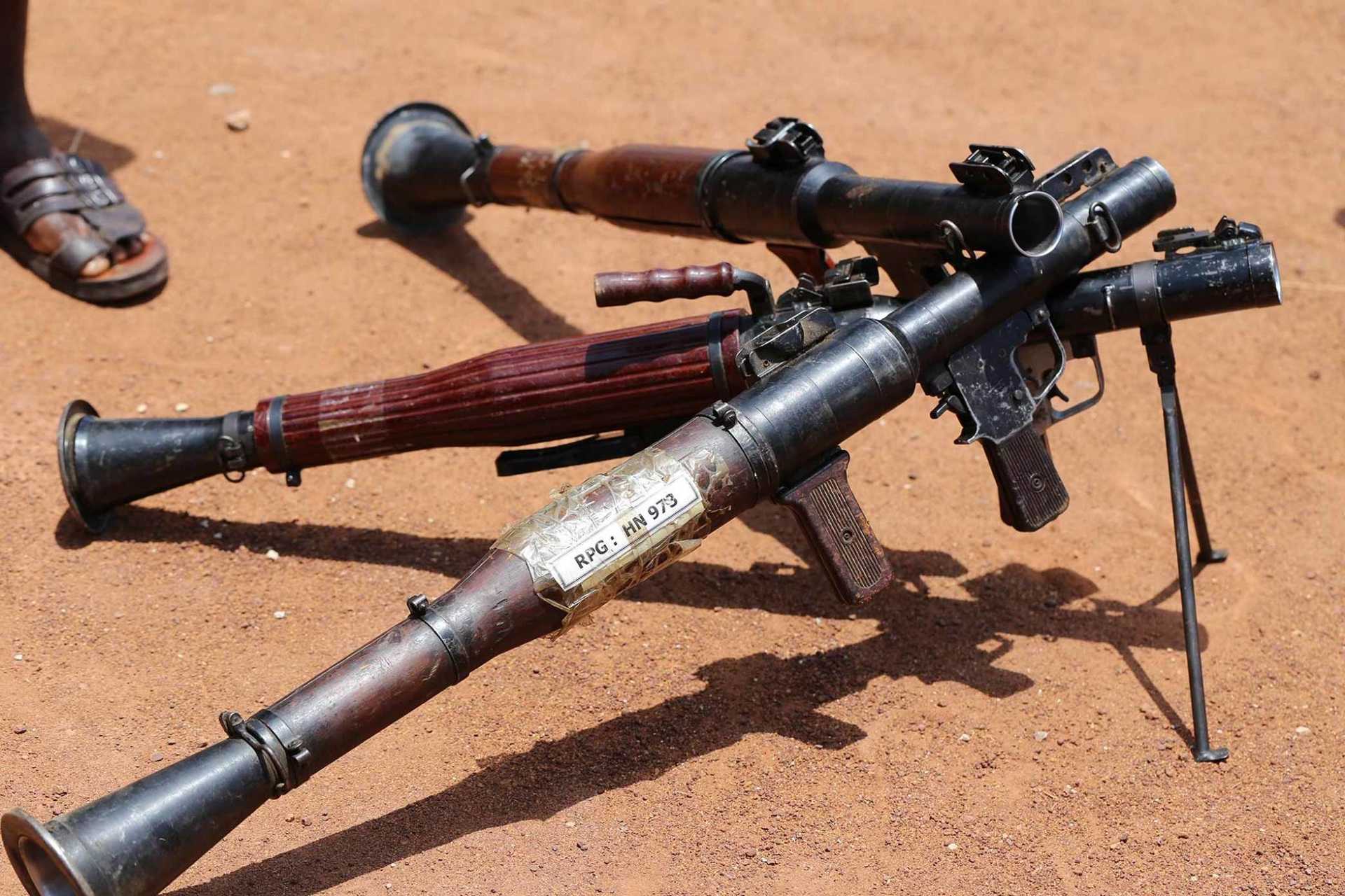 A closeup photo of RPG7 rocket launchers on the ground.