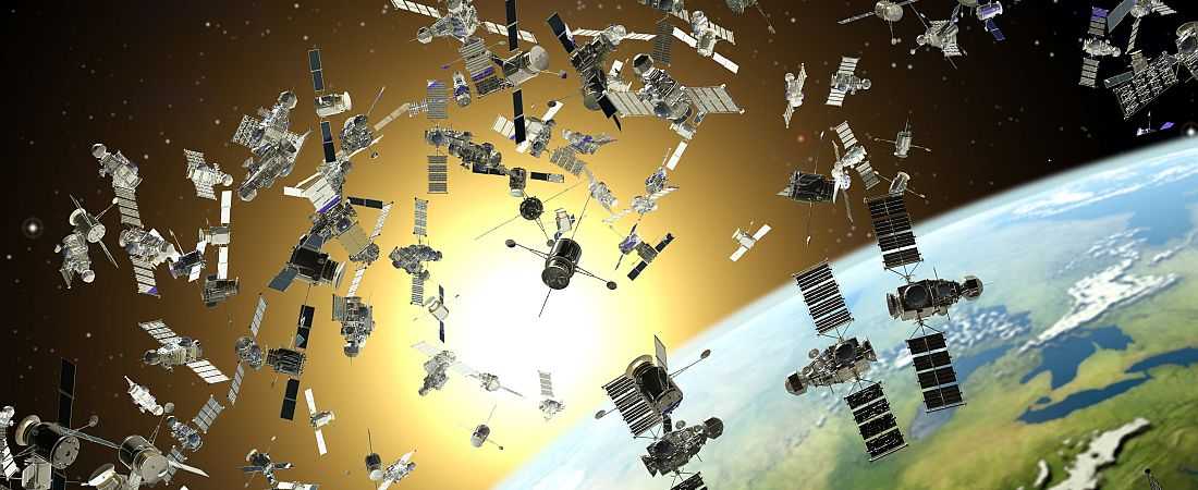 Space junk, conceptual artwork. Large number of satellites orbiting the Earth, representing the hazards of space junk (also called space debris)